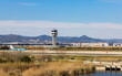 © Cavan - Landing strip at Barcelona airport with planes on the runway