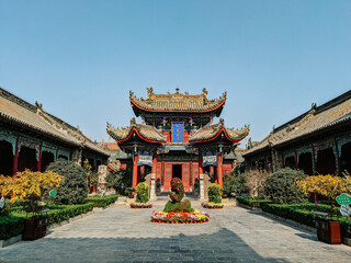 Poster - Historic Buddhist temple with a zen garden in China under a bright sky