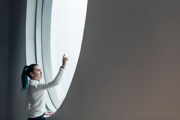 Wall Mural - Girl using touch screen in a modern smart home