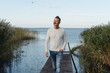 © contrastwerkstatt - Attractive middle-aged man posing on a jetty