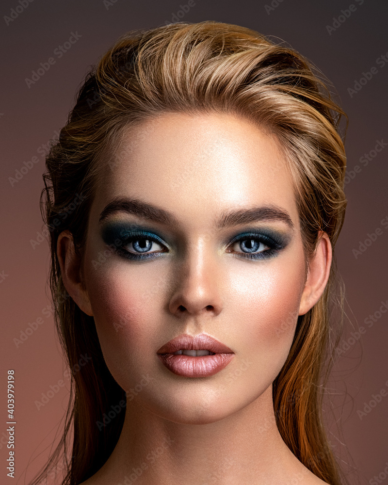 Photo of young woman with style make-up. Portrait of blonde woman with a beautiful  face. Closeup face with stylish blue makeup. Fashion model with long hair,  studio shot. Stock Photo | Adobe, image size:800x1000