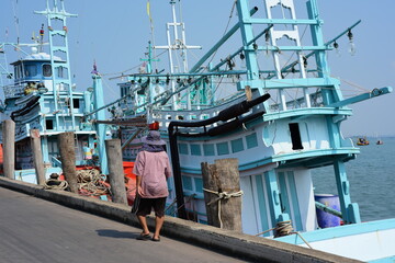 View of the fishing port overlooking the boat and Pattaya city. Which is a large city close to local fishing sources in Thailand