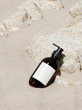 Minimal mockup background for product presentation. Cosmetic bottle and beige stone on sand beach. 3d rendering illustration. Clipping path of each element included.