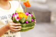 Close-up Of Woman Holding Flower Basket