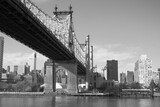 Fototapeta Nowy Jork - Bridge Over River With City In Background
