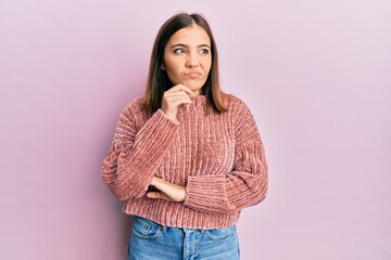 Sticker - Young beautiful woman wearing casual clothes thinking concentrated about doubt with finger on chin and looking up wondering