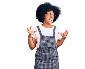 Sticker - Young african american girl wearing casual clothes crazy and mad shouting and yelling with aggressive expression and arms raised. frustration concept.