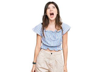 Sticker - Young beautiful caucasian girl wearing casual clothes angry and mad screaming frustrated and furious, shouting with anger. rage and aggressive concept.