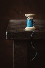 Old Spool Of Thread On Wooden Table. Selective Focus