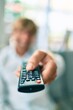 © Krakenimages.com - Close up of middle age handsome caucasian man using tv control