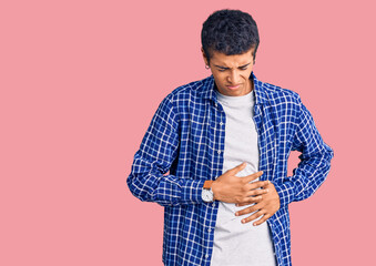 Sticker - Young african amercian man wearing casual clothes with hand on stomach because indigestion, painful illness feeling unwell. ache concept.