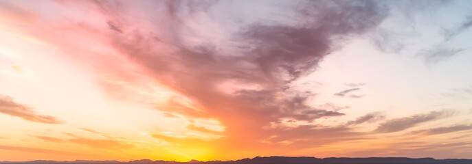 Wall Mural - Stunning view of a dramatic sky with clouds at sunset. Natural background, wallpaper or preset with copy space.