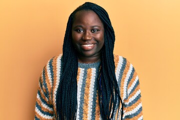 Sticker - Young black woman with braids wearing casual winter sweater with a happy and cool smile on face. lucky person.