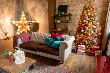 unusual dark interior of the living room in the loft style is decorated with a Christmas tree