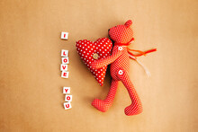 Red With White Polka Dot Toy Bear Holding A Heart With I Love You Text.