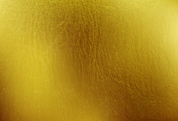 Wall Mural - Golden texture of foil, metal sheet, wrapping paper.