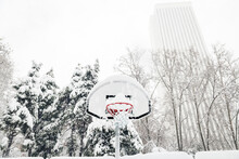Front View Of A Street Basketball Hoop Under The Snow During The Heavy Filomena Storm In Madrid, Spain.