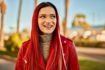 Young caucasian girl smiling happy standing at the city.