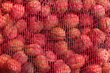 Walnuts pattern in a red net