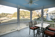 Screen Porch With A View Of The Golf Course In The American South.