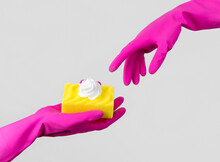 Creative Composition With Female Hands In A Pink Glove And Sponge With Foam