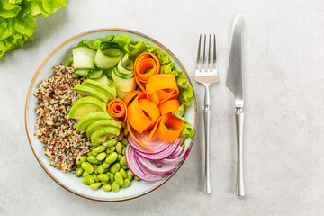 Canvas Print - Buddha bowl - healthy  and balanced food concept. Quinoa, edamame beans, avocado, ququmber, carrot, red onion and green salad.