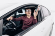 © EdNurg - Funny nerd and geek in huge ridiculous glasses shows his drivers license. Concept of police checks on the roads and the correction of vision for drivers