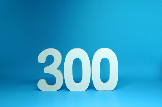 300 ( three hundred ) word Isolated Blue Background with Copy Space - Number 300% Percentage or Promotion - Discount or anniversary concept             