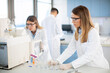 © BGStock72 - Female scientists in a white lab coat putting vial with a sample for an analysis on a ionchromatography system in biomedical lab