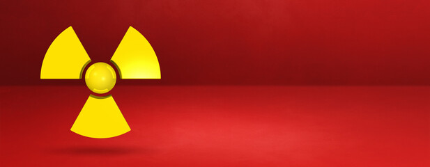 Radioactive symbol on a red studio background banner