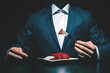 Supper of blue blood aristocrat. Portrait of handsome,young man eating fresh meat . Classical suit.  Luxury style. Indoor shot - Image