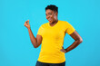 © Prostock-studio - African Oversized Woman Clicking Fingers Standing Posing On Blue Background