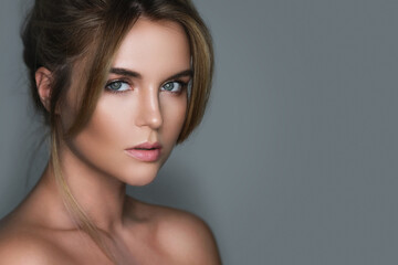Wall Mural - young and stunning woman with a natural makeup