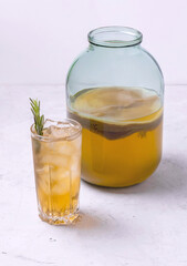 Wall Mural - kombucha in a glass jar and a glass with ice. Healthy drink