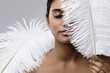 © blackday - Young and sensual Indian woman with a soft ostrich feather