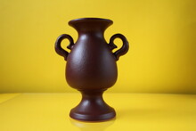 Brown Amphora Vase With Handles On A Yellow Background Copyspace