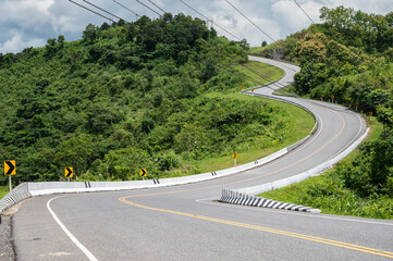 Wall Mural - Beautiful steep curved road (look like number 3) on the high mountain in Nan province, Thailand. An iconic tourist attraction place on the way to Bo Kluea (means salt well) district.