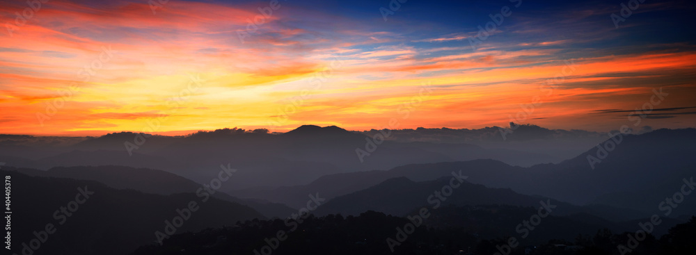 Scenic View Of Silhouette Mountains Against Orange Sky - obrazy, fototapety, plakaty 