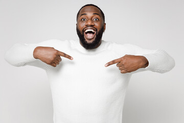 Wall Mural - Excited surprised funny young african american man 20s wearing casual basic sweater standing pointing index fingers on himself looking camera isolated on white color wall background studio portrait.