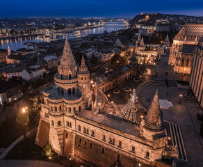 Sticker - Budapest, Hungary - Aerial view of the famous illuminated Fisherman's Bastion with Szechenyi Chain Bridge and Buda Castle Royal Palace at christmas time winter evening