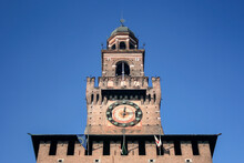 The Clock Tower Of Sforza Castle In Milan, It Was Built In The 15th Century By Francesco Sforza, Duke Of Milan Lombardy. Landmark Of Italy