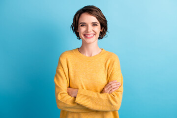 Sticker - Photo portrait of cheerful happy female student with folded hands smiling isolated on bright blue color background