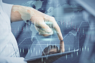Poster - Double exposure of man's hands holding and using a digital device and forex graph drawing. Financial market concept.