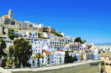 Buildings In Old Town Ibiza Against Clear Blue Sky