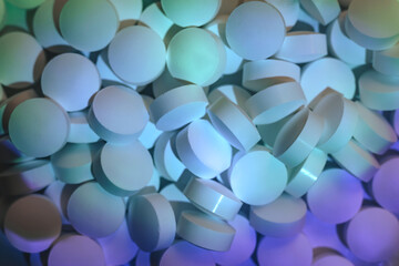 Fototapete - Pills or drugs in a package under neon light. Beautiful background pattern for design.