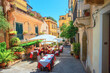 Cityscape with street cafe in old town Taormina. Sicily, Italy