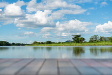 Forest River Wild Water View. Beautiful Wooden Jetty And Nice Sky Background With Many Shape Clouds. Slow Life Relax In Green Nature Concept. Selective Focus , Copy Space
