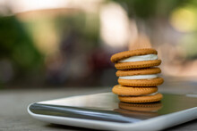 Fresh Milk Butter Cookies On A Digital Scale With Natural Light Background.