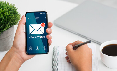 Poster - Newslettering Concept. Woman Got New Message On Smartphone While Working In Office