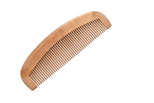 Close-up Of Wooden Comb Against White Background